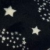 Negro con estrellas blancas